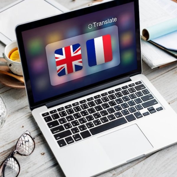 computer with uk and french flags